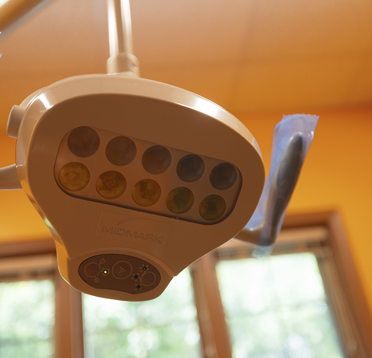 Overhead lamp for pediatric dental treatments
