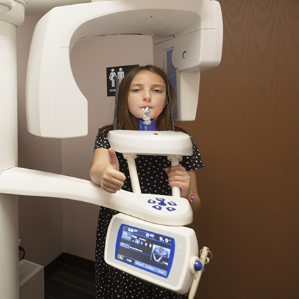 Little girl having dental X-rays taken