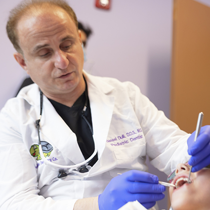 Pediatric dentist in Naperville treating a patient