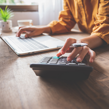 Patient checking clipboard and using calculator